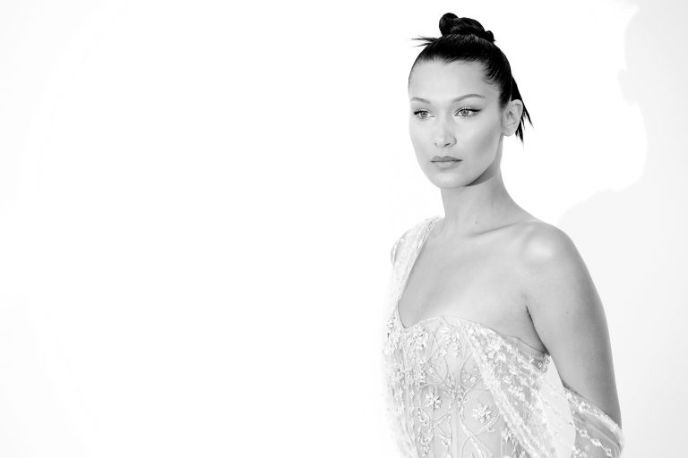 Celebrity Bella Hadid posts glittering photos wearing gold jewelry for brand