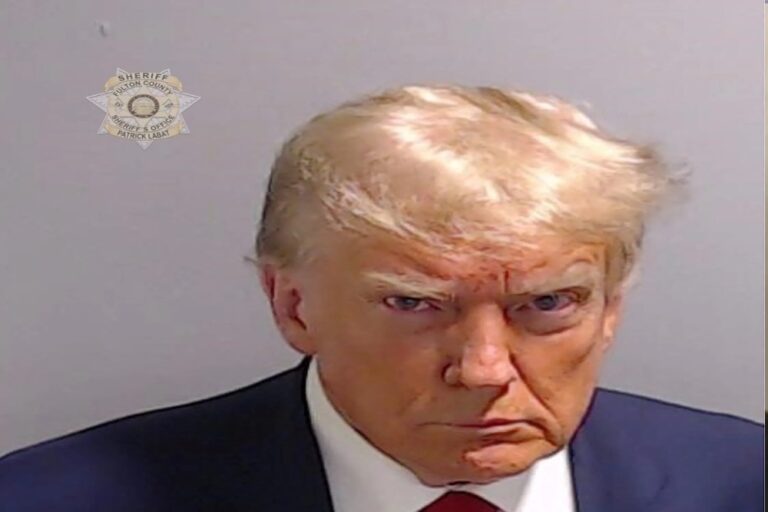 Former President Donald Trump posts his mug shot on social media, all 19 defendants surrender