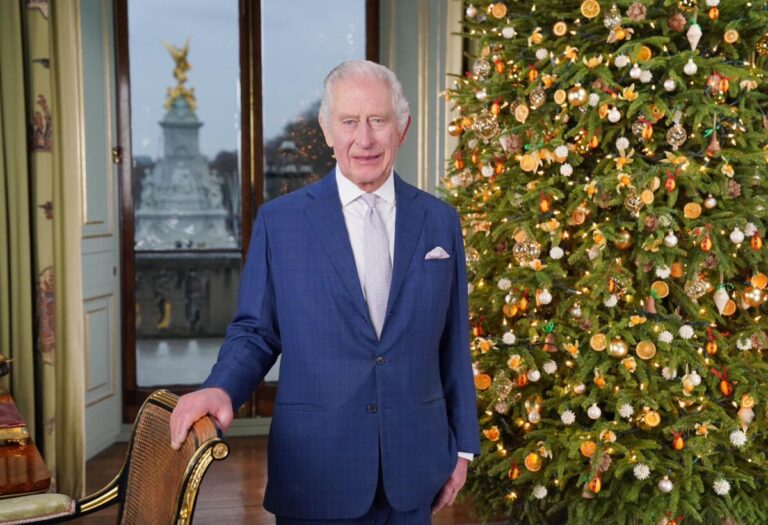 King Charles III Christmas Day Address Features Live Tree Against Buckingham Palace Background