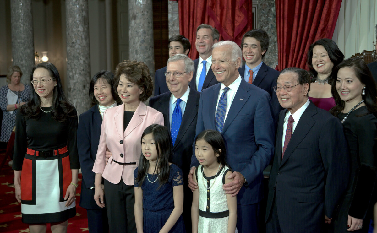 Washington DC, USA, January 6, 2015 Senate Majority Leader Senator Mitch McConnell (R-KY) and his wife Elaine Chao pose for pictures with their families and Vice President Joe Biden after being sworn